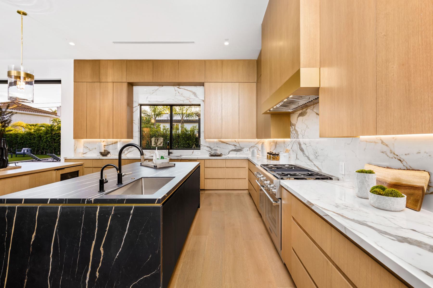 modern-kitchen-with-wooden-cabinets-and-marble-countertop