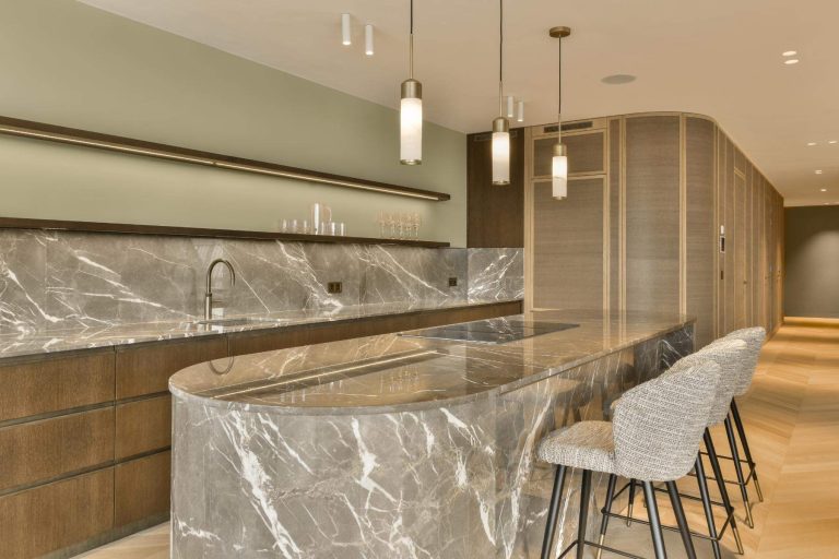 Modern kitchen design featuring marble island top