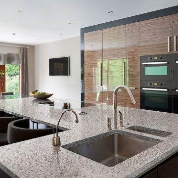 Polished granite kitchen island with cabinetry