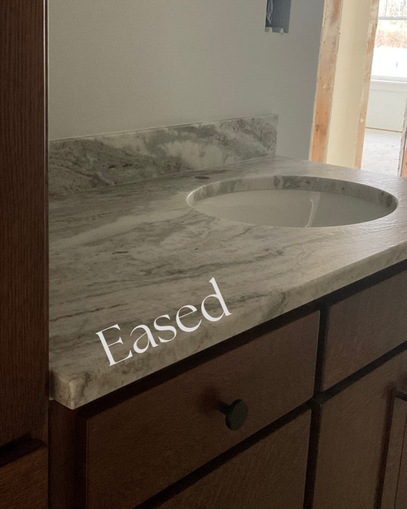 Eased countertop edge profile on marble bathroom vanity with undermount sink